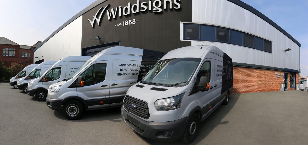 Widd Signs factory with transit vans outside